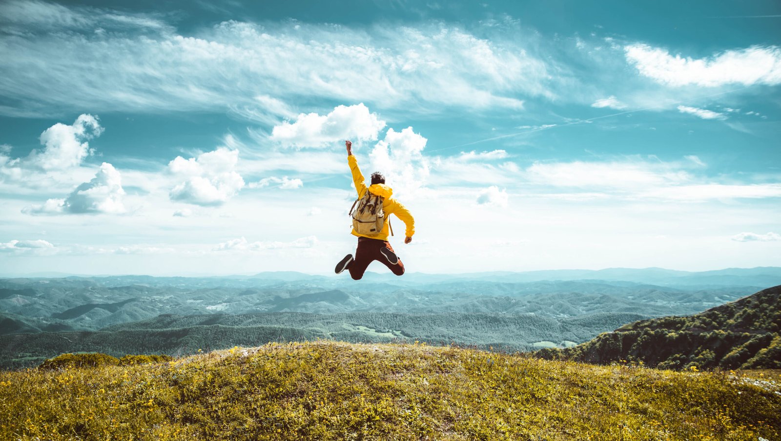 hiker-with-backpack-raising-hands-jumping-on-the-t-2022-12-17-03-39-33-utc